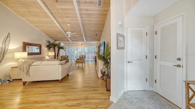 living room with light hardwood / wood-style floors, wood ceiling, lofted ceiling with beams, and ceiling fan