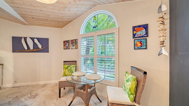 living area featuring wooden ceiling and vaulted ceiling