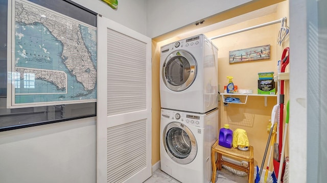 laundry room featuring stacked washer and clothes dryer