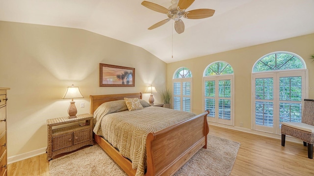 bedroom with vaulted ceiling, light hardwood / wood-style flooring, and ceiling fan