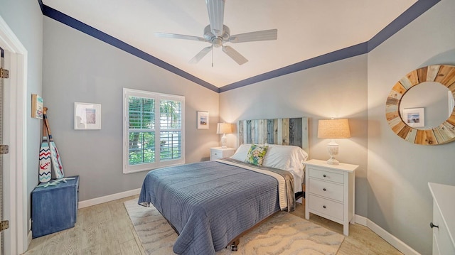 bedroom with vaulted ceiling, light wood-type flooring, and ceiling fan