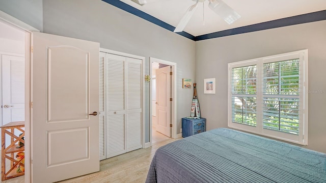 bedroom featuring a closet, ceiling fan, and light hardwood / wood-style floors