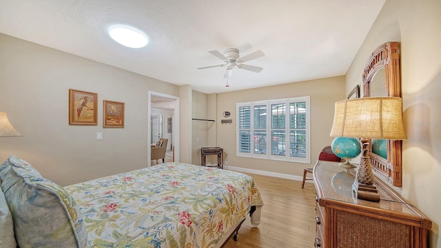 bedroom featuring light hardwood / wood-style floors and ceiling fan