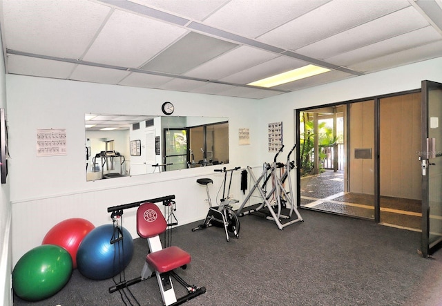 workout room featuring a paneled ceiling