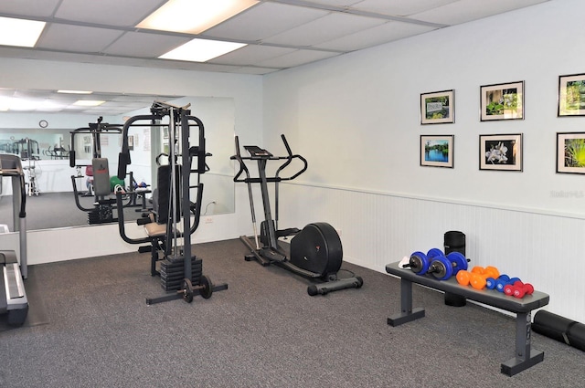 workout area featuring a drop ceiling