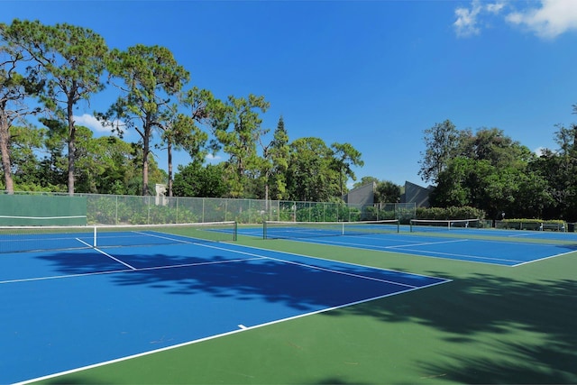 view of tennis court featuring basketball court