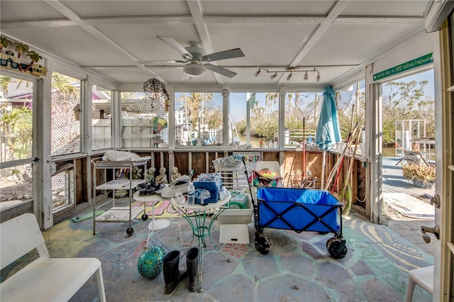 sunroom / solarium featuring a wealth of natural light, coffered ceiling, and ceiling fan