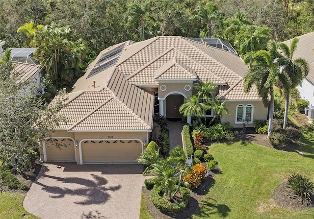 view of front of home with a front yard and a garage