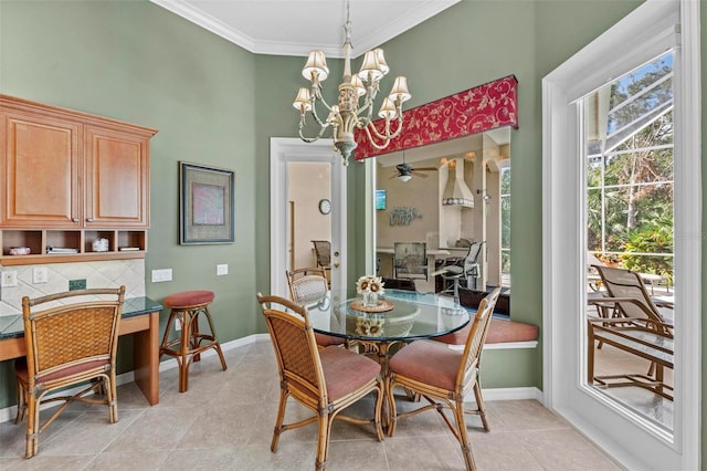 tiled dining room with ceiling fan with notable chandelier and crown molding