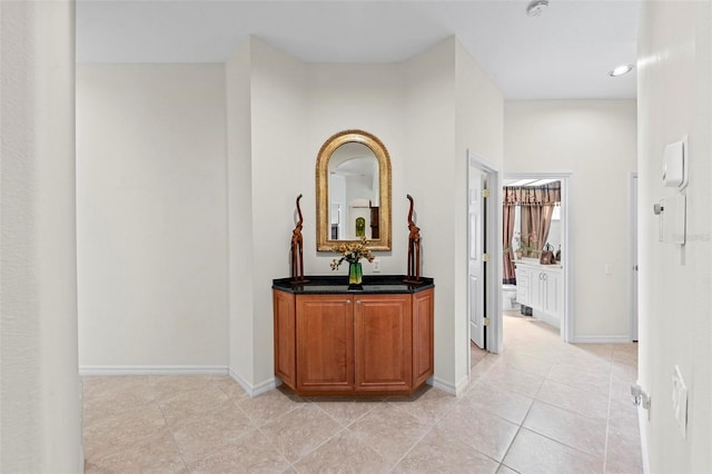 hallway with light tile patterned floors