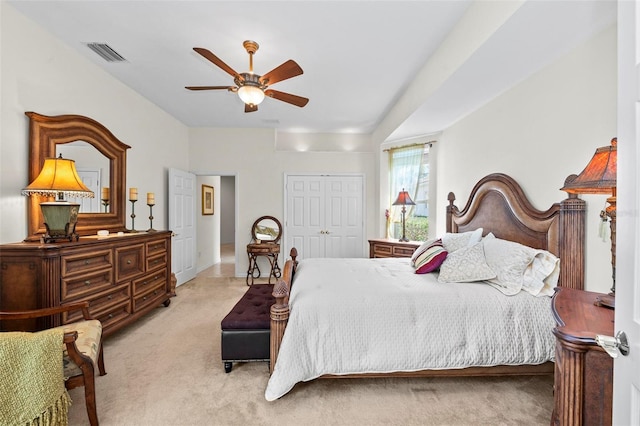 bedroom featuring light carpet, a closet, and ceiling fan