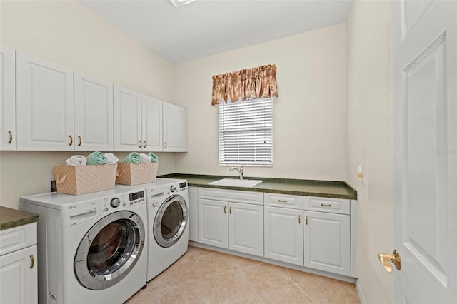 laundry area with light tile patterned flooring, cabinets, sink, and washing machine and dryer