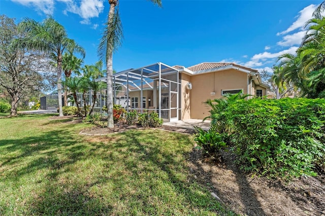 view of yard featuring a lanai