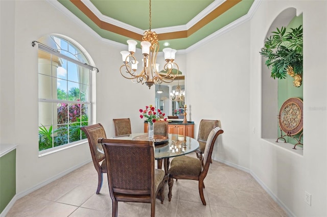 dining room featuring crown molding, light tile patterned floors, and an inviting chandelier