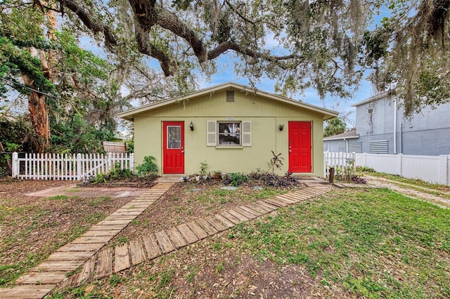 bungalow with a front lawn