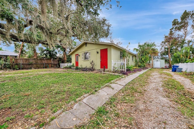 ranch-style house with a front lawn