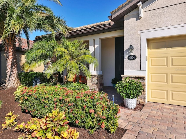 doorway to property featuring a garage