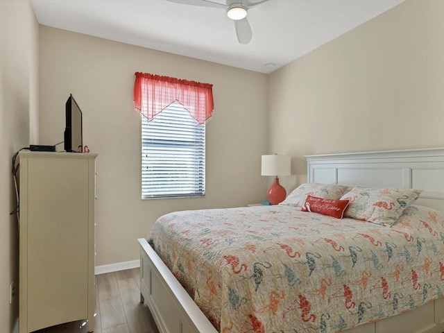 bedroom with ceiling fan and light hardwood / wood-style flooring