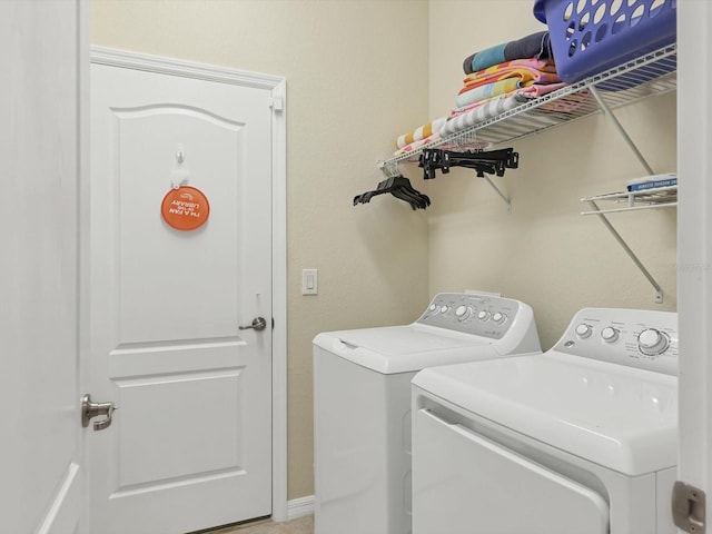 laundry room featuring washer and clothes dryer