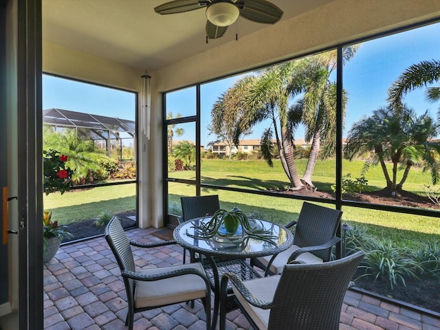 sunroom / solarium with ceiling fan