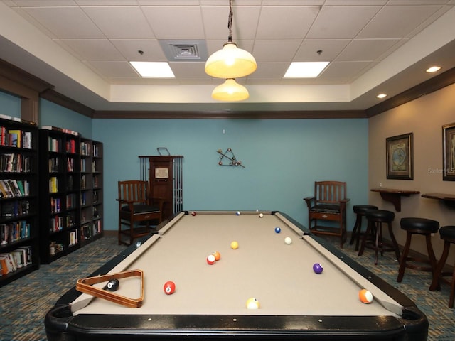 game room with ornamental molding, billiards, a tray ceiling, and carpet