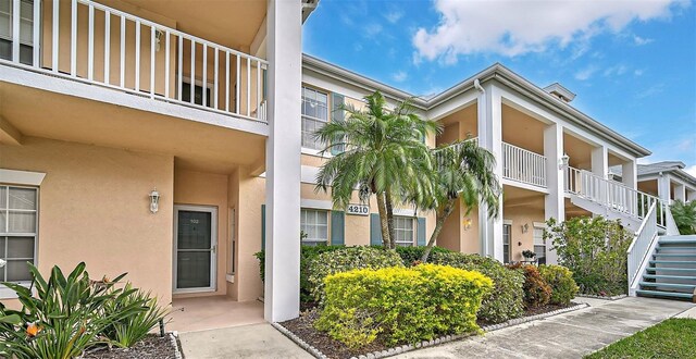 4210 Caddie Dr E Unit 102, Bradenton, FL 34203 - view of property featuring stairs