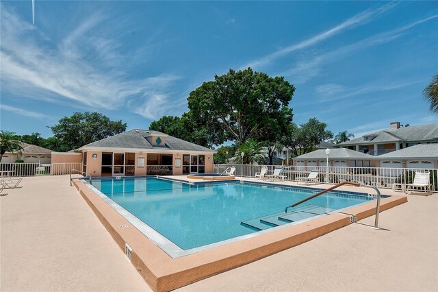 4210 Caddie Dr E Unit 102, Bradenton, FL 34203 - community pool featuring a patio, fence, and a community hot tub