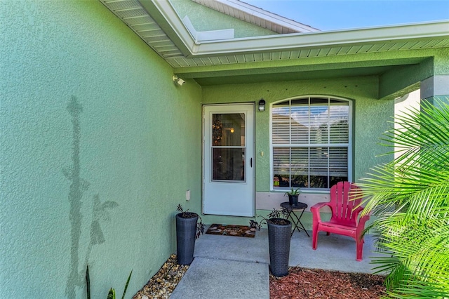 property entrance with a patio