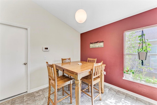 dining area with vaulted ceiling