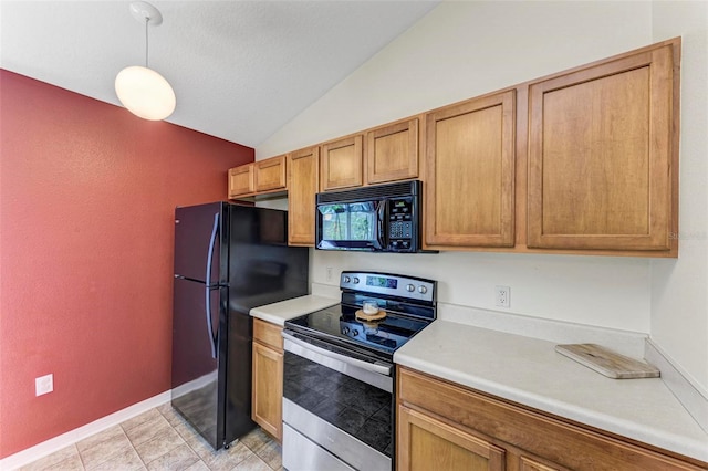 kitchen featuring lofted ceiling, decorative light fixtures, and black appliances