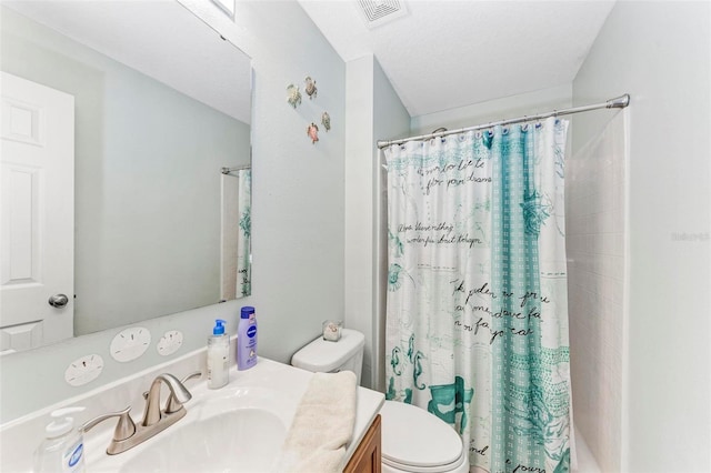 bathroom featuring vanity, toilet, a textured ceiling, and a shower with curtain