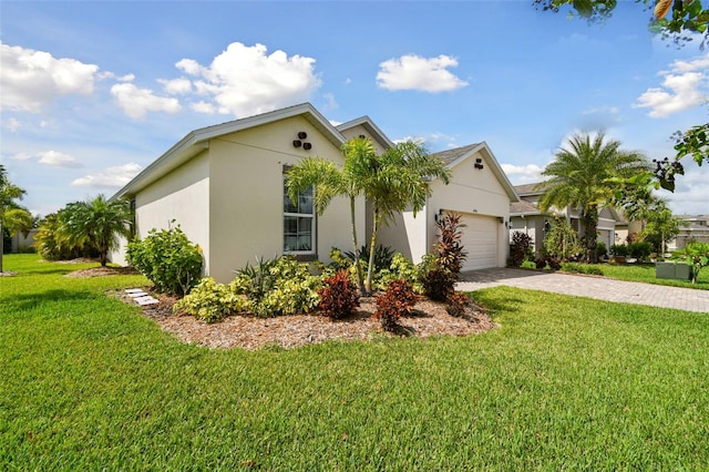 single story home with a front yard and a garage