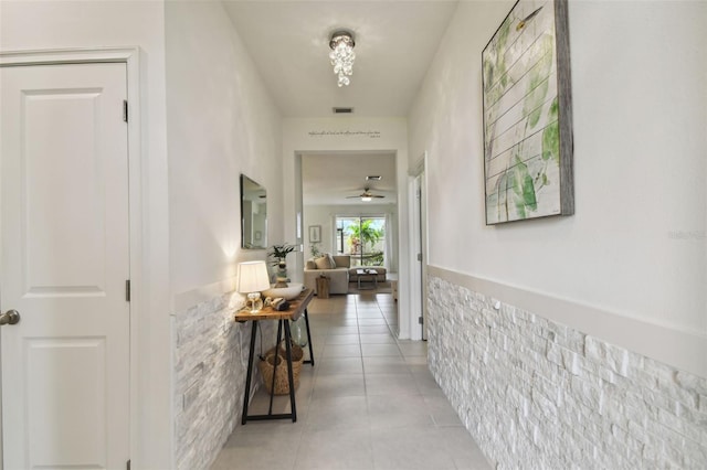 corridor with light tile patterned floors