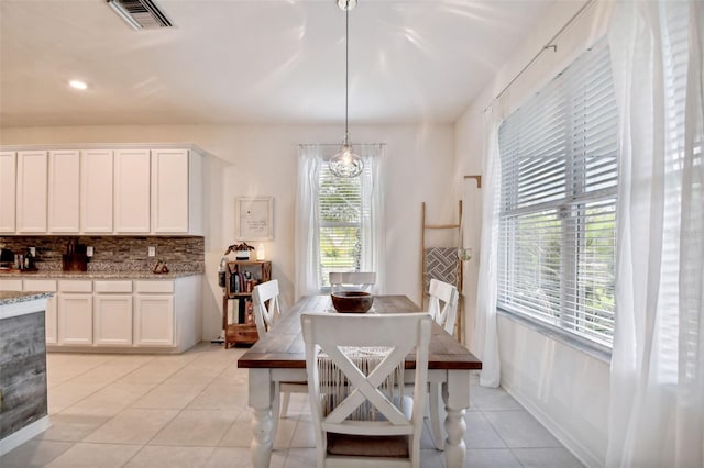 dining space with light tile patterned floors