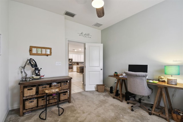 office featuring light carpet and ceiling fan