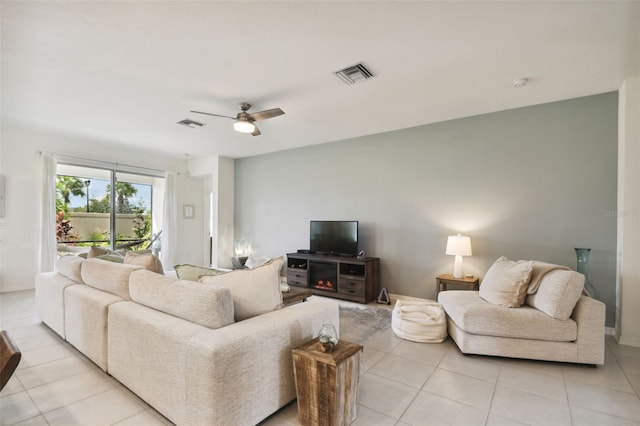 living room with light tile patterned floors and ceiling fan