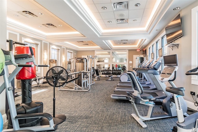 workout area featuring crown molding, carpet flooring, and coffered ceiling