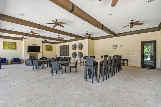 dining room featuring beamed ceiling