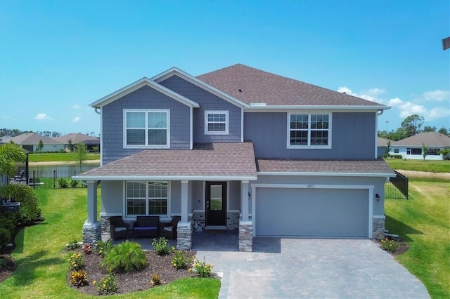 view of front of property with a front lawn and a garage