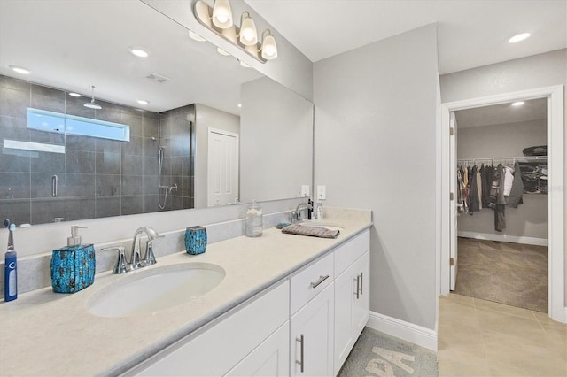 bathroom with vanity, tile patterned floors, and walk in shower