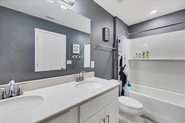 full bathroom with toilet, shower / bath combo with shower curtain, and vanity