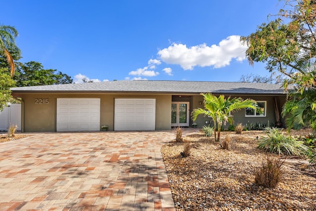 ranch-style home with a garage