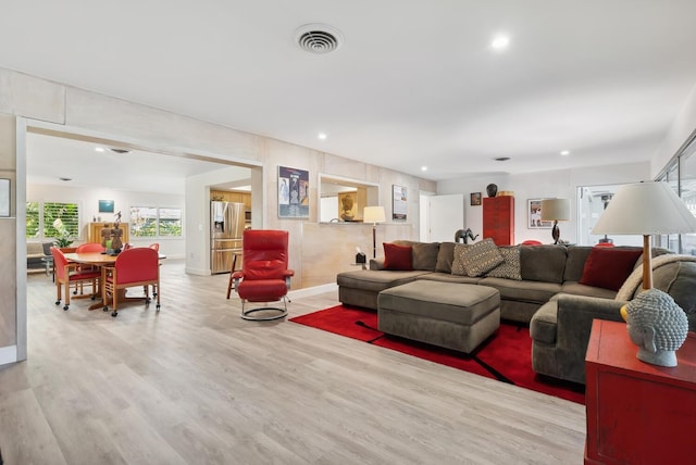 living room with light hardwood / wood-style floors