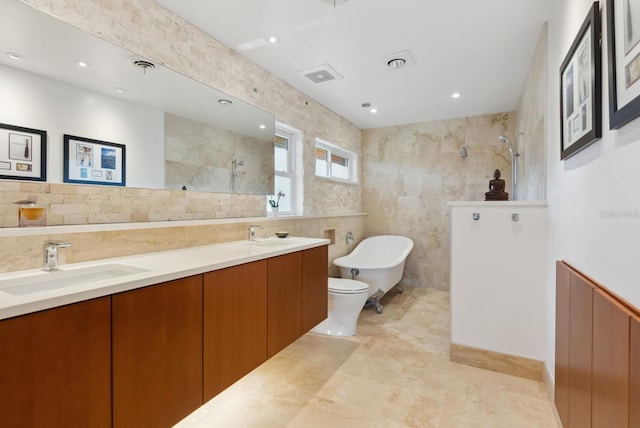 full bathroom featuring vanity, toilet, tile walls, and plus walk in shower