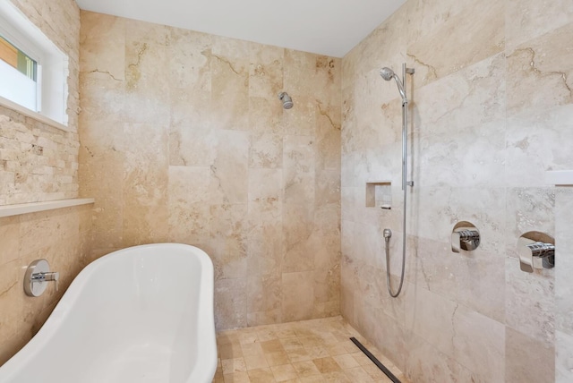 bathroom with shower with separate bathtub