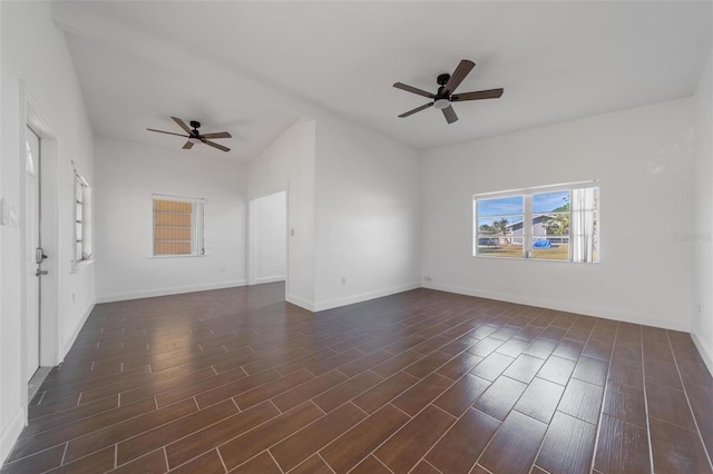 unfurnished room featuring ceiling fan and dark hardwood / wood-style flooring