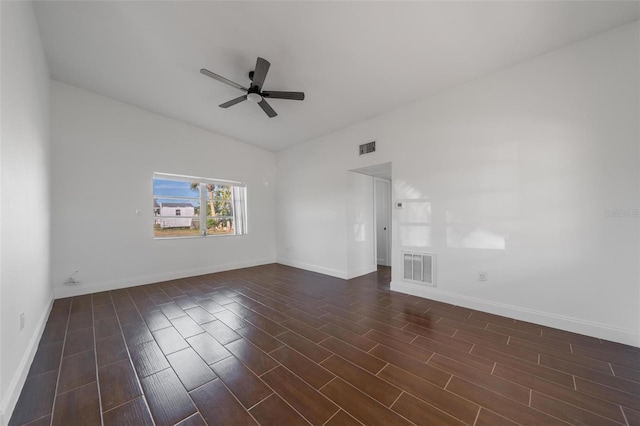 unfurnished room featuring dark wood-type flooring and ceiling fan