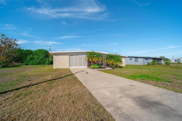 ranch-style home with a front yard