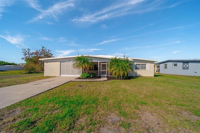 ranch-style home with a garage and a front yard