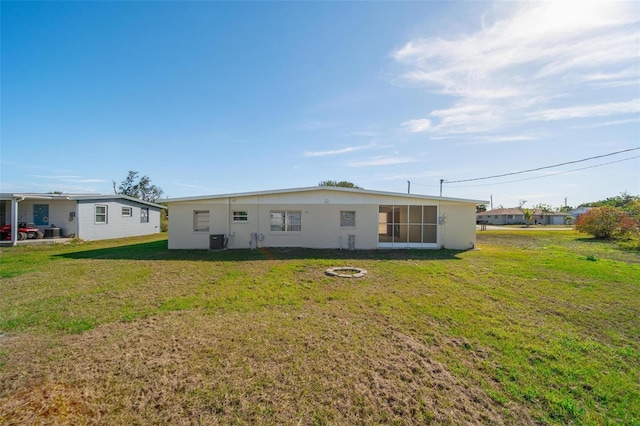 back of house with a yard